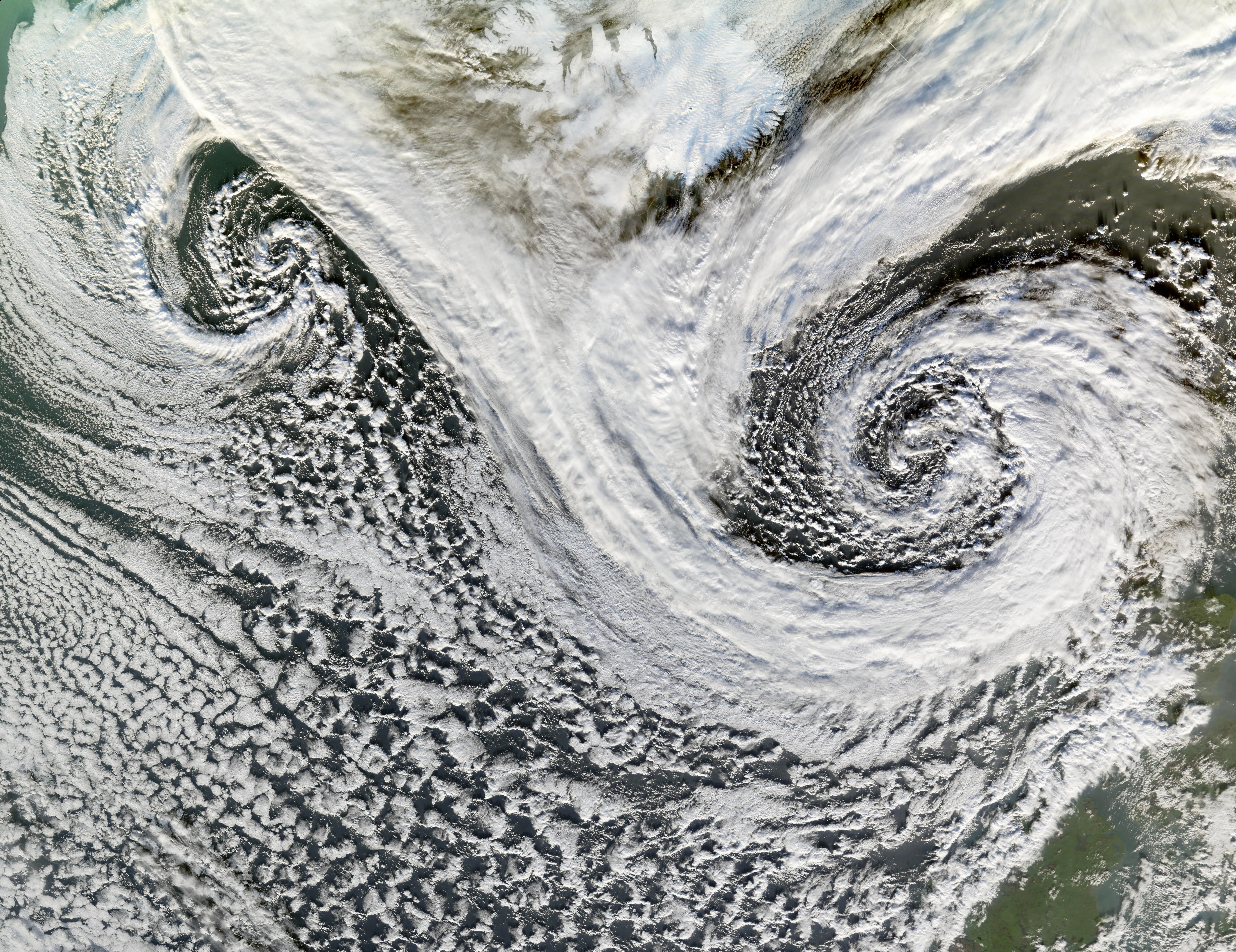 A powerful cyclone seen from Earth's orbit, showcasing its massive swirling cloud structure.